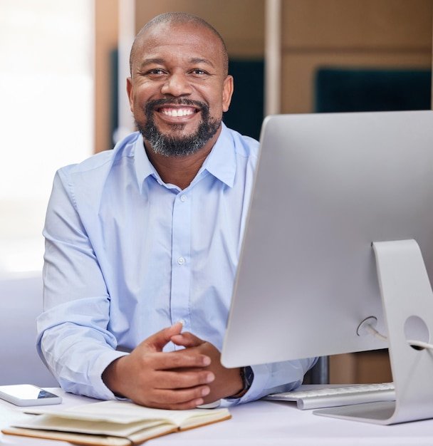computer business portrait black man office with notebook planning online project proposal corporate consultant desk happy worker pc email website research 590464 356860 229189960